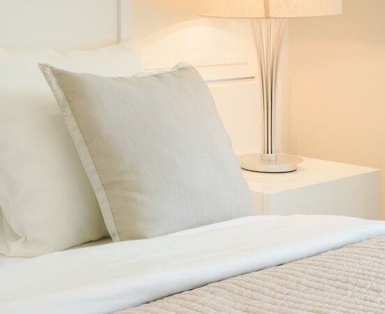 Beige Pillow On Comfy Bed